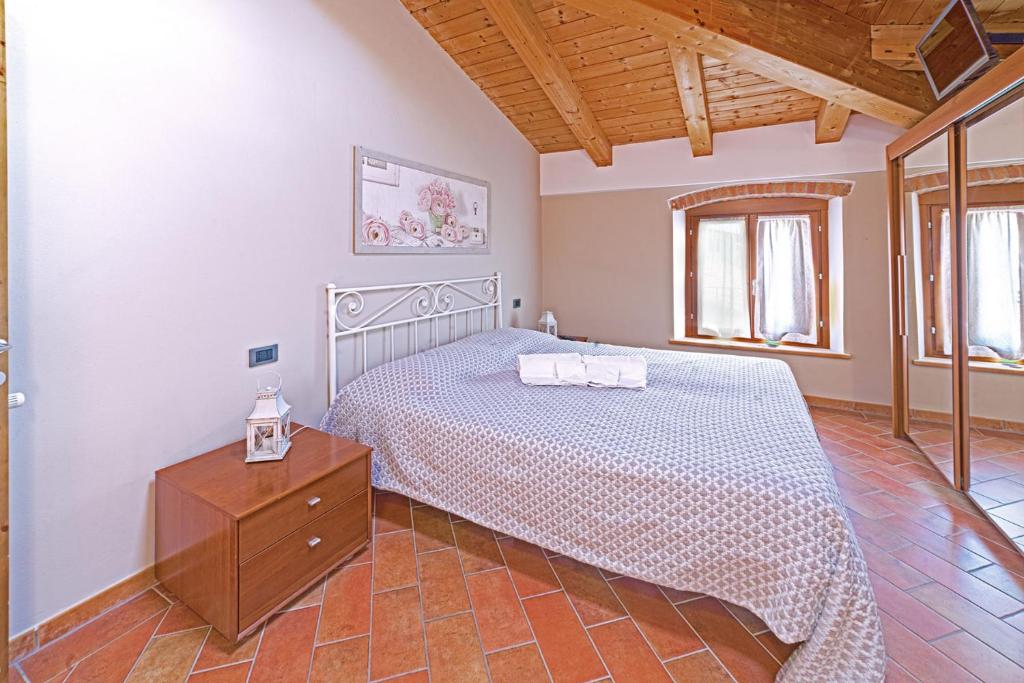Postel nebo postele na pokoji v ubytování Agriturismo Corte Albarel