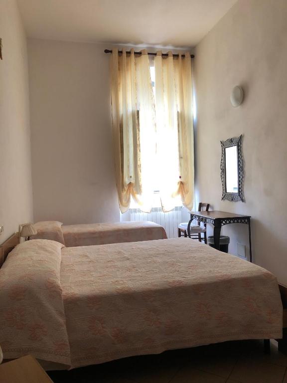 Posteľ alebo postele v izbe v ubytovaní Residenza Pitigliano Gens Petilia - Nuova gestione