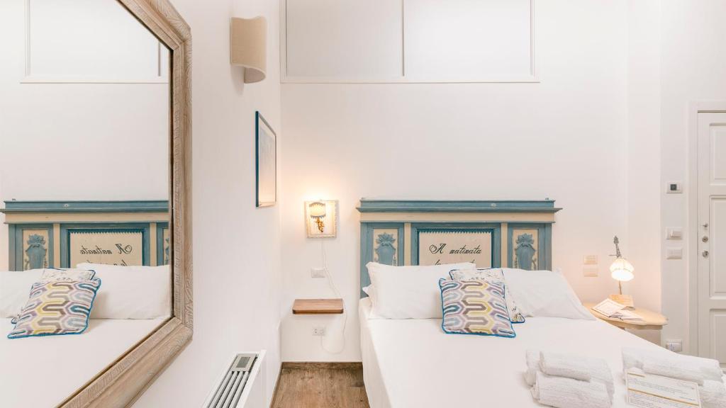 Ένα ή περισσότερα κρεβάτια σε δωμάτιο στο Addimora Boutique Suites