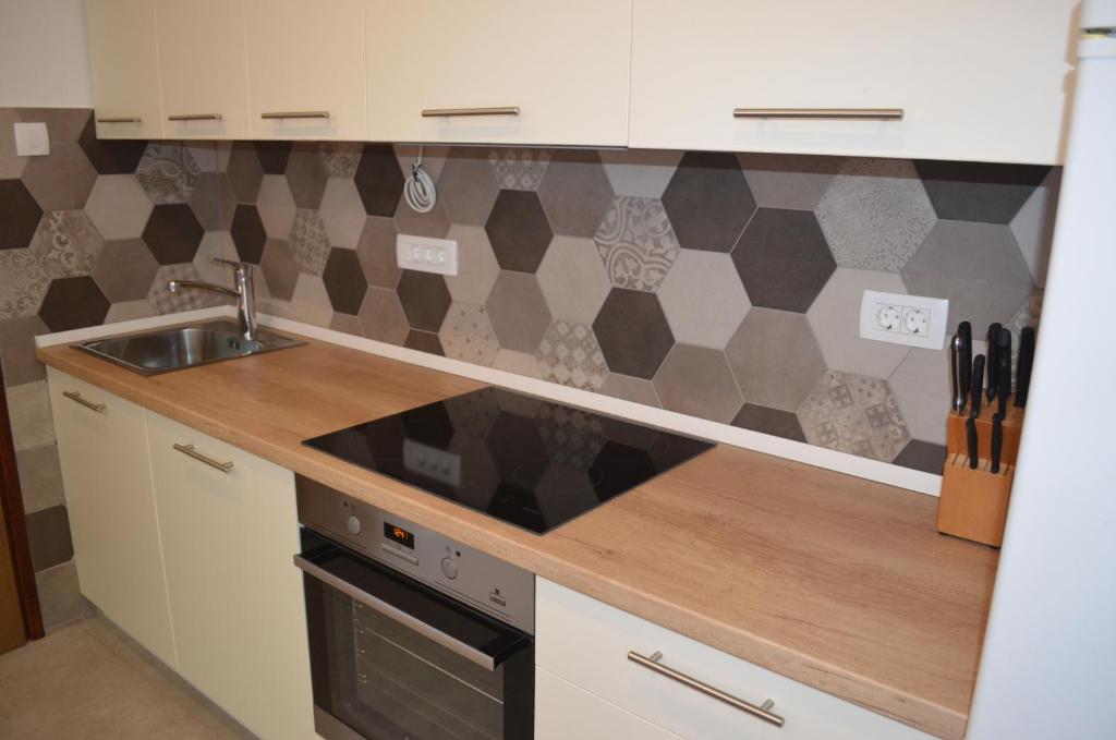 Kuchyň nebo kuchyňský kout v ubytování Apartments Mare