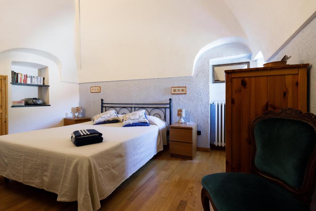 Posteľ alebo postele v izbe v ubytovaní Arvé Castelbianco - B&B e Appartamento