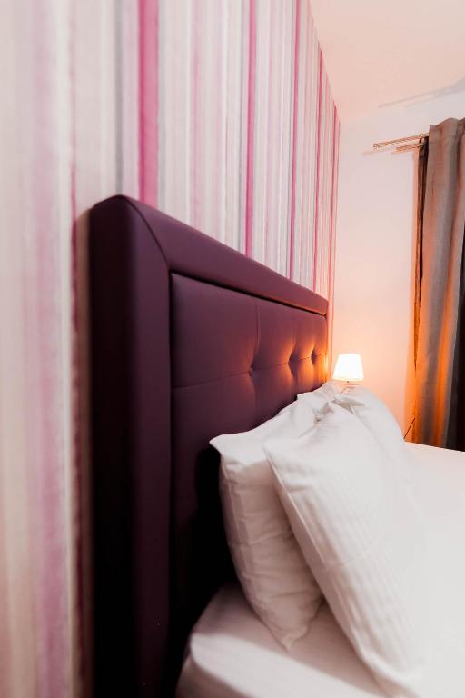 Postel nebo postele na pokoji v ubytování Hotel Torini