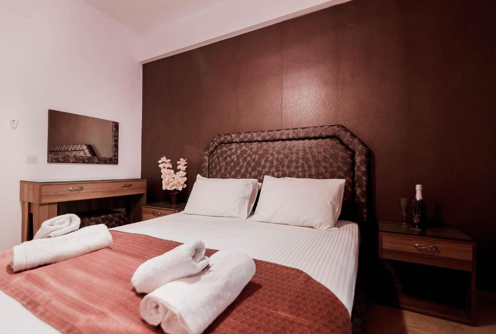 Postel nebo postele na pokoji v ubytování Hotel Torini