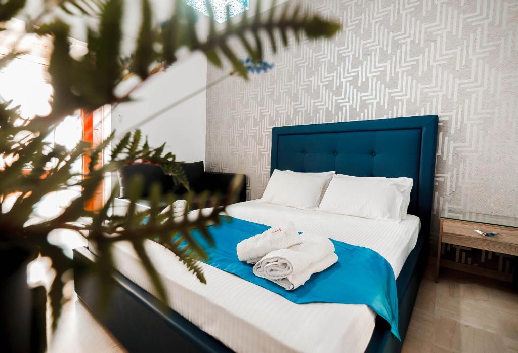 Postel nebo postele na pokoji v ubytování Hotel Torini