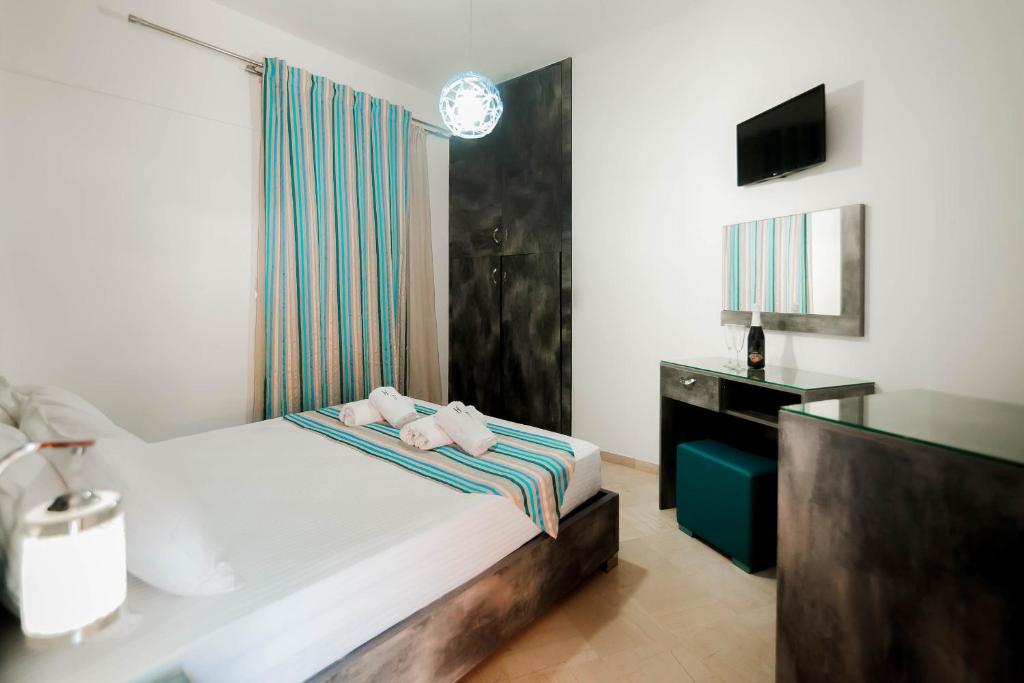 Postel nebo postele na pokoji v ubytování Hotel Torini