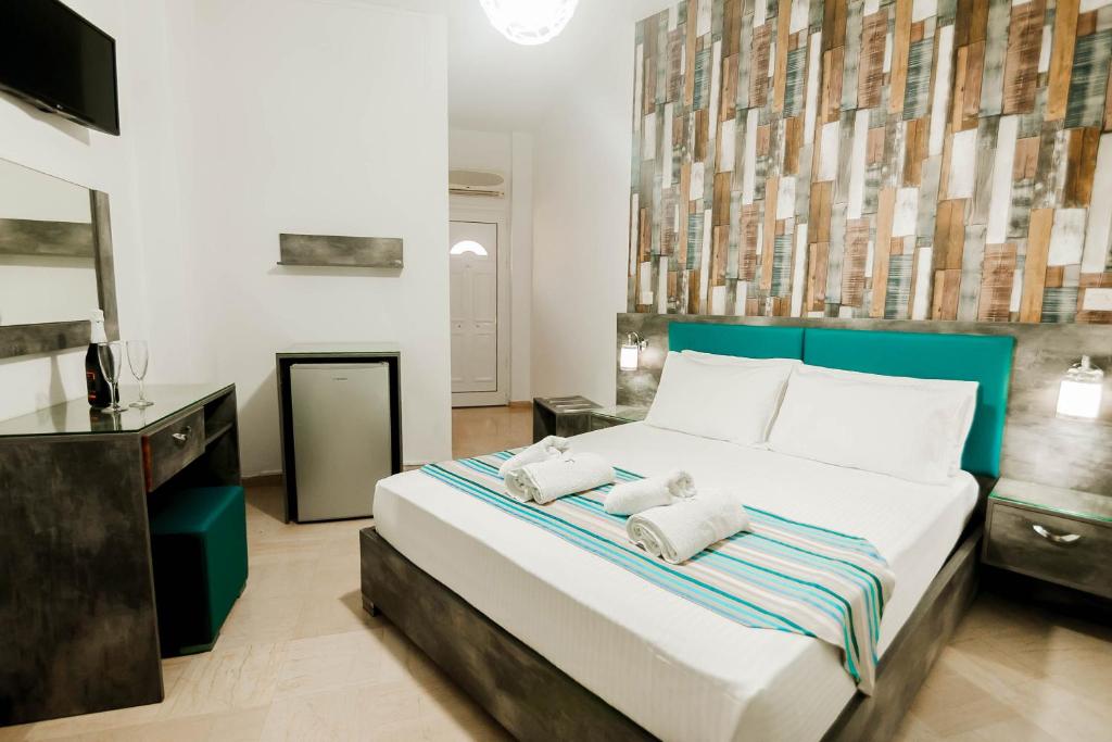 Postel nebo postele na pokoji v ubytování Hotel Torini