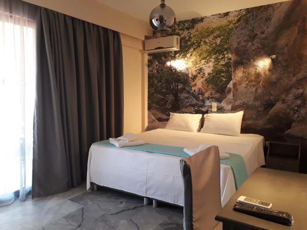 Postel nebo postele na pokoji v ubytování Enalion Beach Hotel