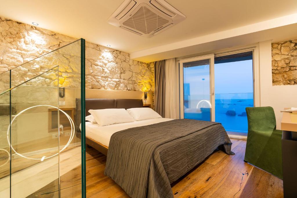 Posteľ alebo postele v izbe v ubytovaní Re Dionisio Luxury Suites