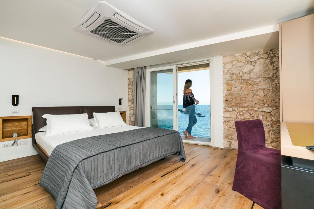 Posteľ alebo postele v izbe v ubytovaní Re Dionisio Luxury Suites