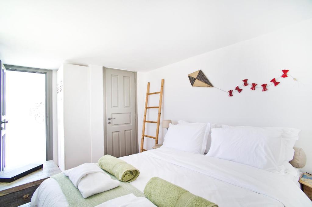 Łóżko lub łóżka w pokoju w obiekcie ANTELMI LUXURY VILLA