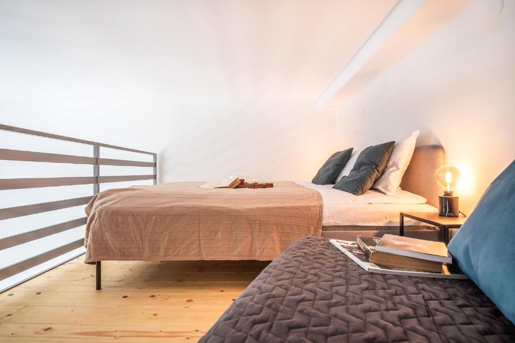 Posteľ alebo postele v izbe v ubytovaní Tower Street Apartments