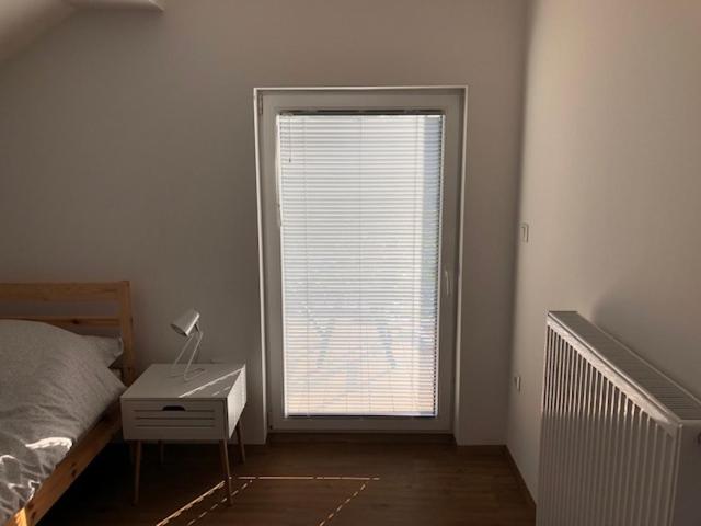 Postel nebo postele na pokoji v ubytování Apartma na hüti