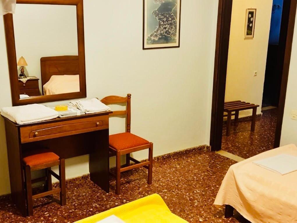 Postel nebo postele na pokoji v ubytování Hotel Alkyon