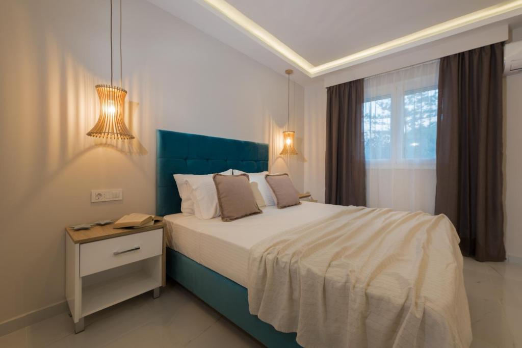 Postel nebo postele na pokoji v ubytování Margaritari Apartments