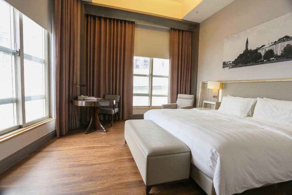 Postel nebo postele na pokoji v ubytování City Suites - Taipei Nandong
