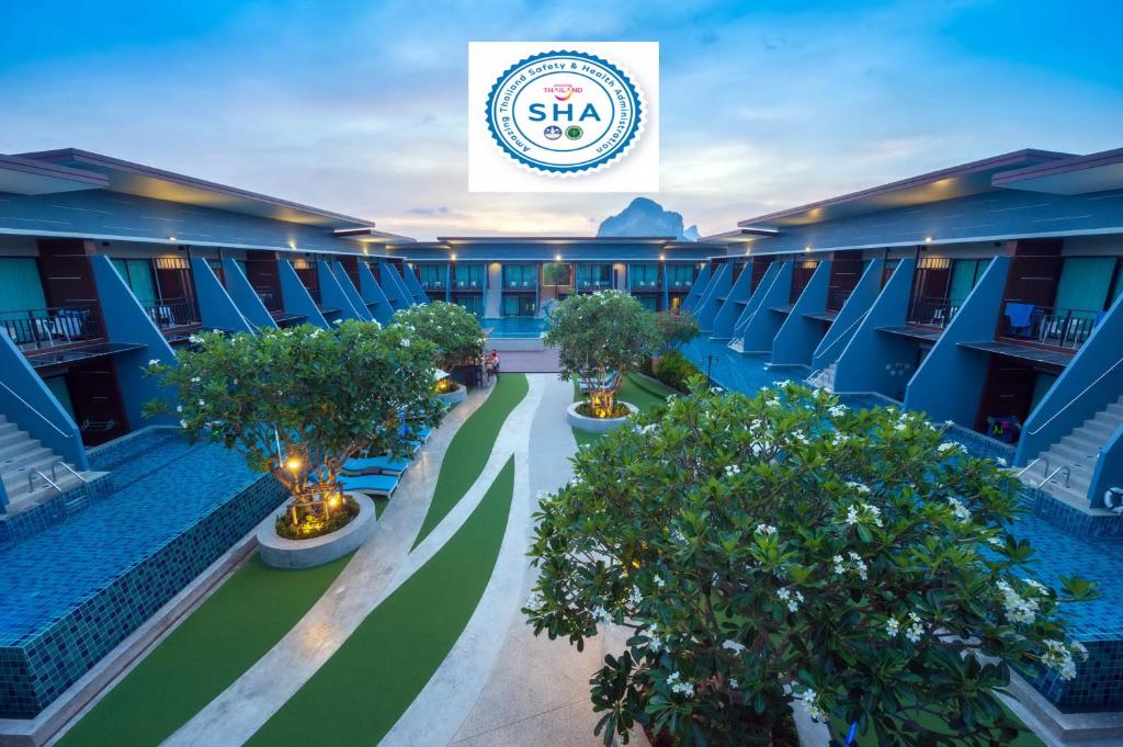 una vista aérea del patio de un hotel con árboles en The Phu Beach Hotel - SHA Plus, en Ao Nang Beach