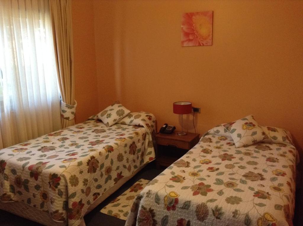 Postel nebo postele na pokoji v ubytování Hotel Le Mirage