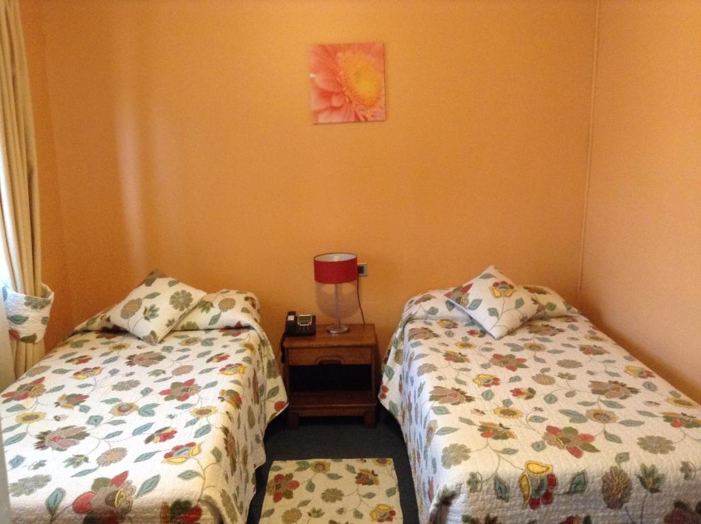 Postel nebo postele na pokoji v ubytování Hotel Le Mirage