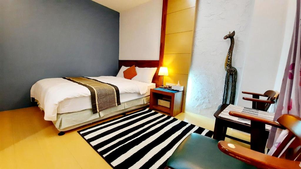 Postel nebo postele na pokoji v ubytování Kenting Chingshan Inn