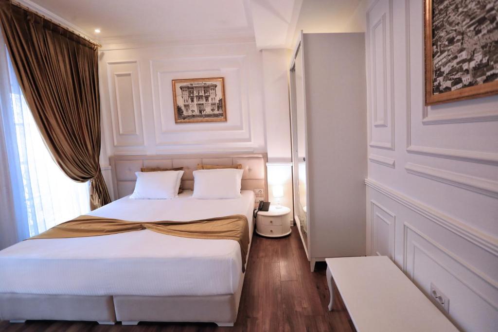 Postel nebo postele na pokoji v ubytování Eler Hotel