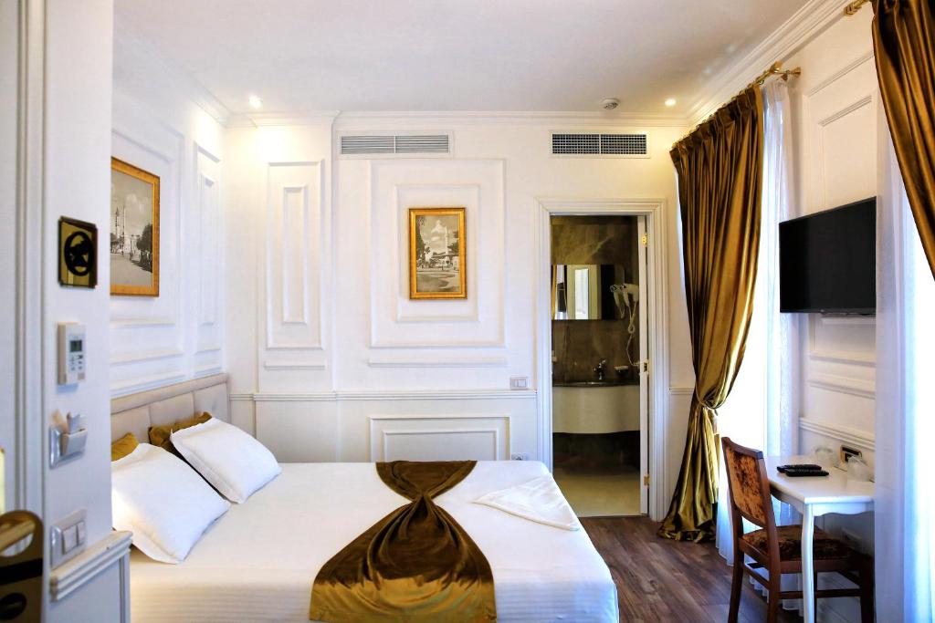 Postel nebo postele na pokoji v ubytování Eler Hotel
