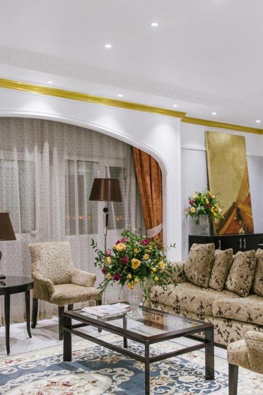 a living room with a couch and a coffee table at Mangrove Hotel in Ras al Khaimah