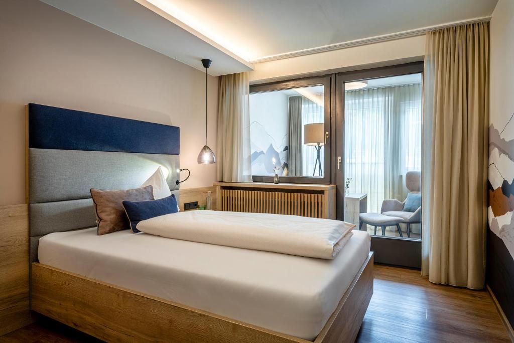 Una cama o camas en una habitación de Hotel Klingler