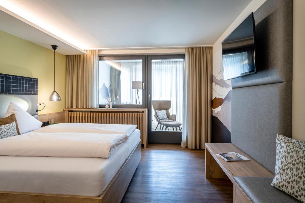 Una cama o camas en una habitación de Hotel Klingler