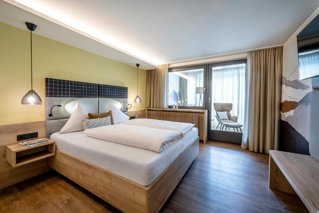Una cama o camas en una habitación de Hotel Klingler