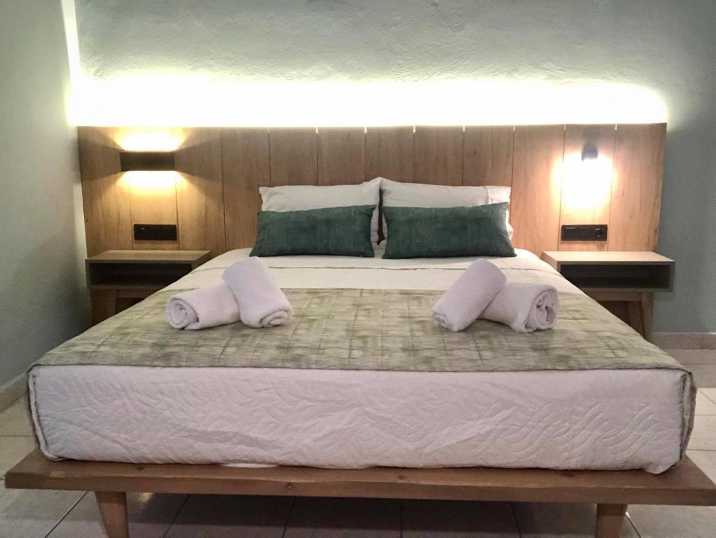 Postel nebo postele na pokoji v ubytování Poledas Apartments