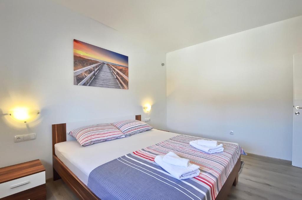 Postel nebo postele na pokoji v ubytování VILLA ALEXANDRIA