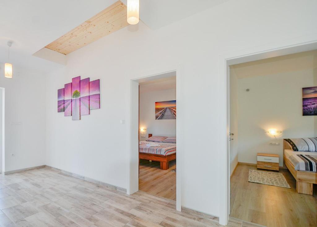 Postel nebo postele na pokoji v ubytování VILLA ALEXANDRIA