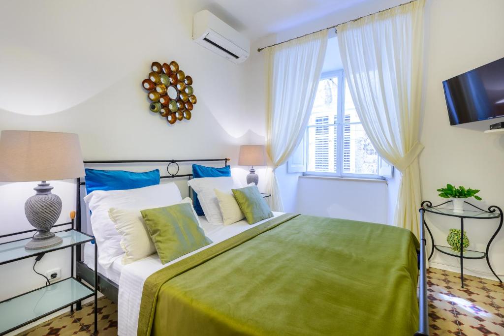 Кровать или кровати в номере Guest House Flores