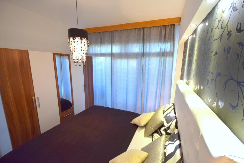 Postel nebo postele na pokoji v ubytování Apartments Antonija