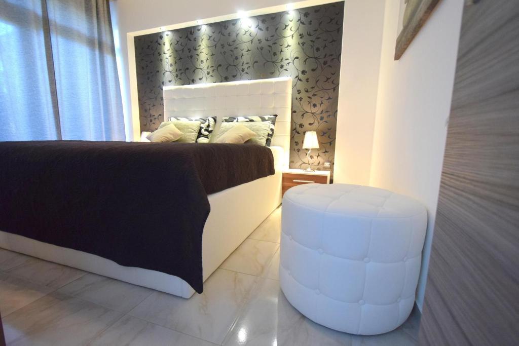 Postel nebo postele na pokoji v ubytování Apartments Antonija