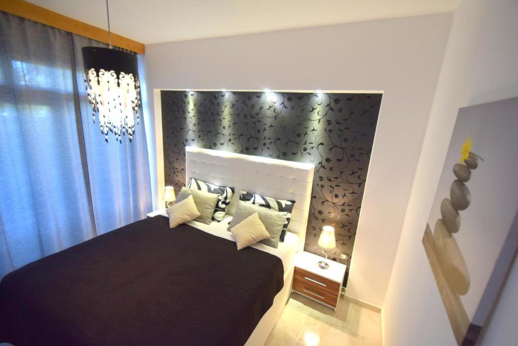 Postel nebo postele na pokoji v ubytování Apartments Antonija