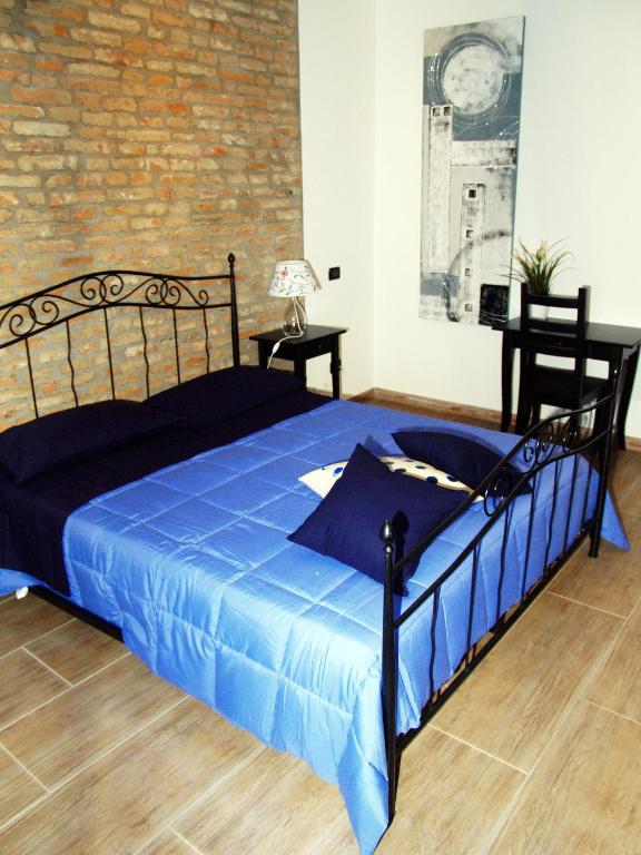 Posteľ alebo postele v izbe v ubytovaní R&B Locanda Le Bighe