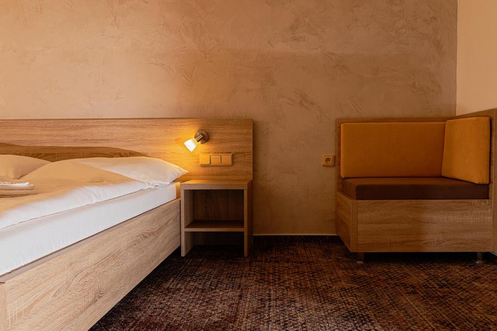 Postel nebo postele na pokoji v ubytování Hotel Slezan
