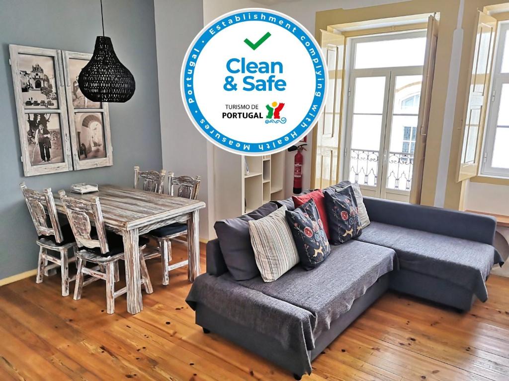 a living room with a couch and a table at Casas de Alcamim in Elvas