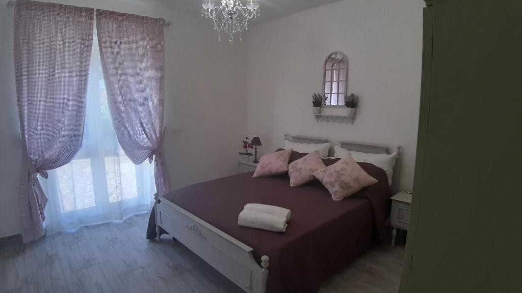 Łóżko lub łóżka w pokoju w obiekcie Agriturismo Corte degli Angeli