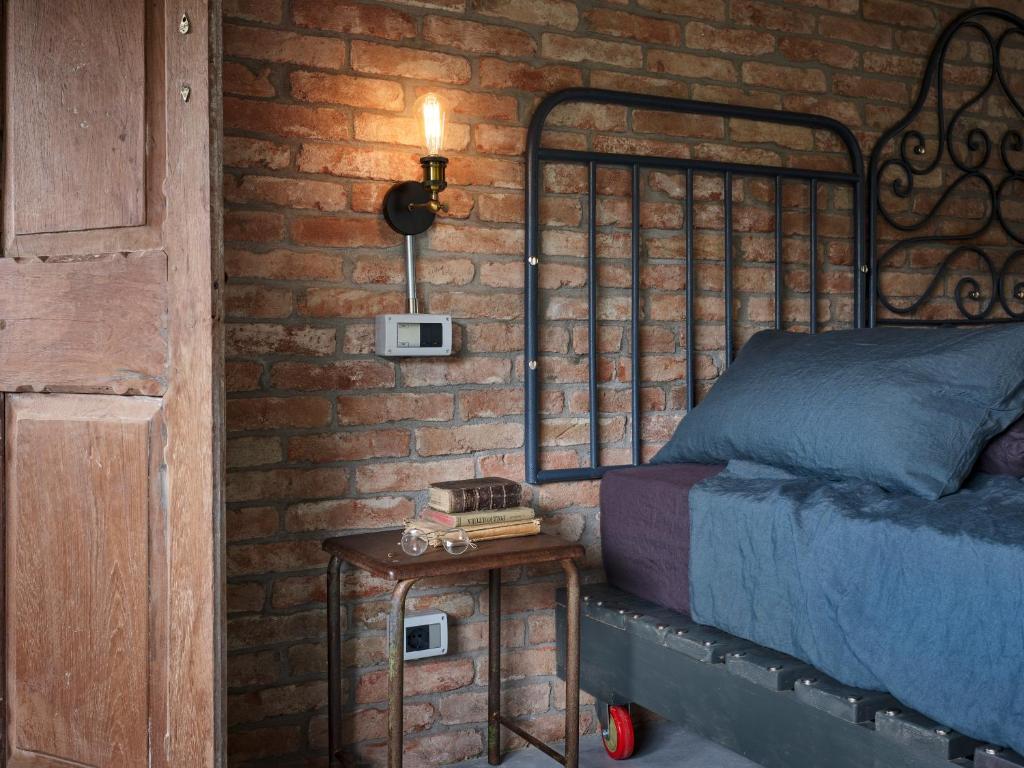 Postel nebo postele na pokoji v ubytování Cascina Facelli - Luxury Country House