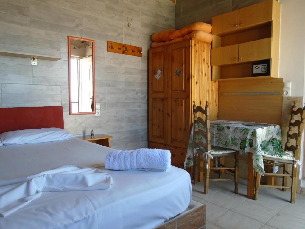 Voodi või voodid majutusasutuse Orfeas Rooms toas