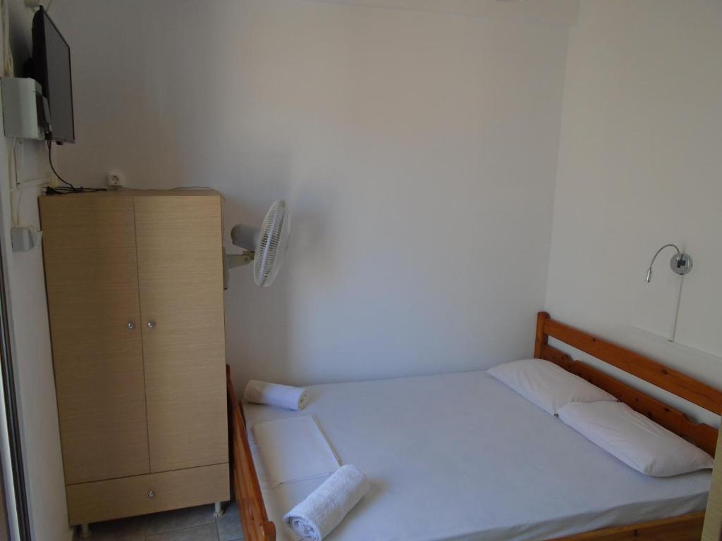 Voodi või voodid majutusasutuse Orfeas Rooms toas