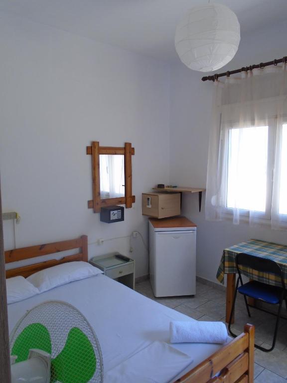 Voodi või voodid majutusasutuse Orfeas Rooms toas