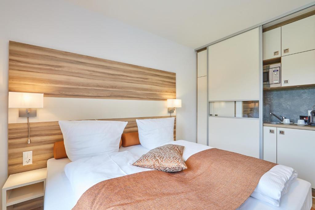 Postel nebo postele na pokoji v ubytování VR-Serviced Apartments Obergeis