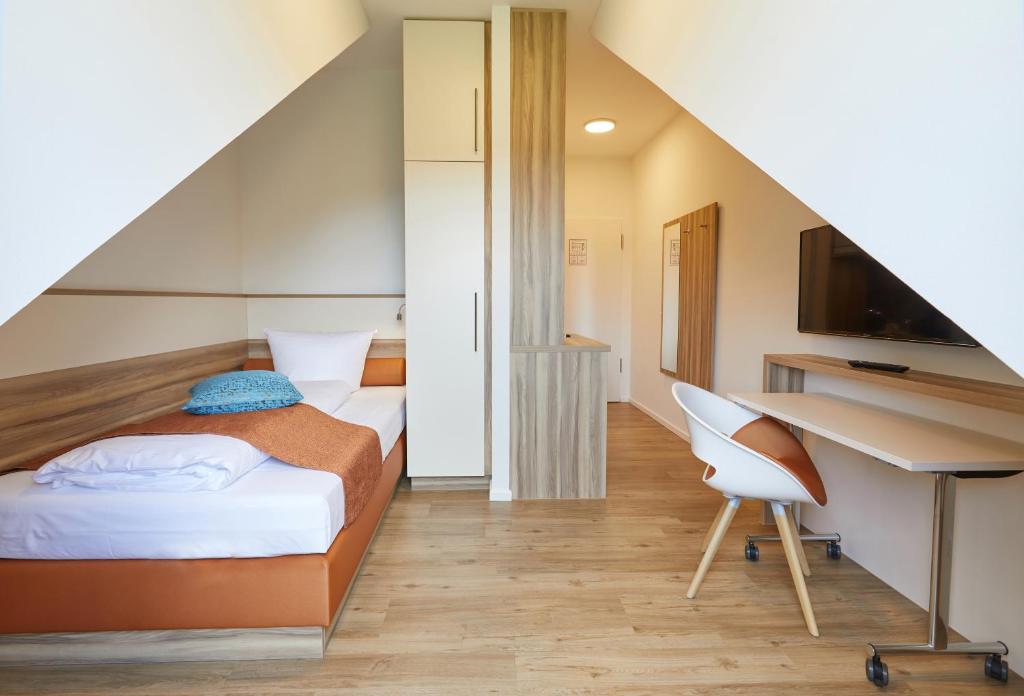 Postel nebo postele na pokoji v ubytování VR-Serviced Apartments Obergeis
