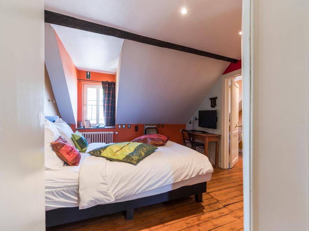 Postel nebo postele na pokoji v ubytování Hotel Dufays