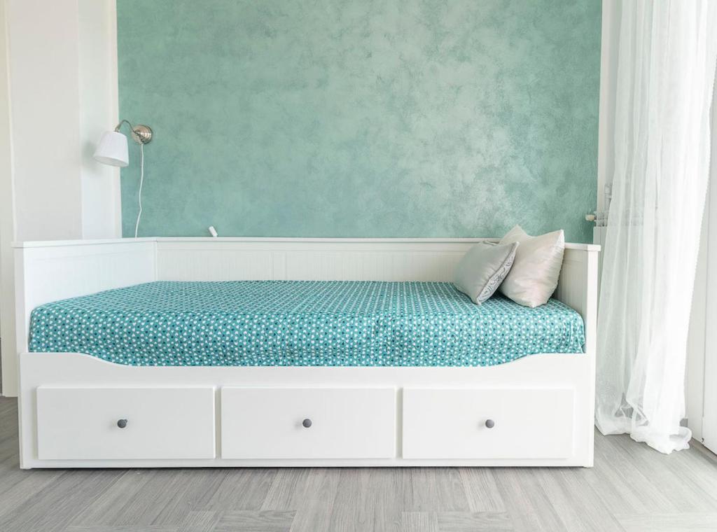 A bed or beds in a room at La Terrazza