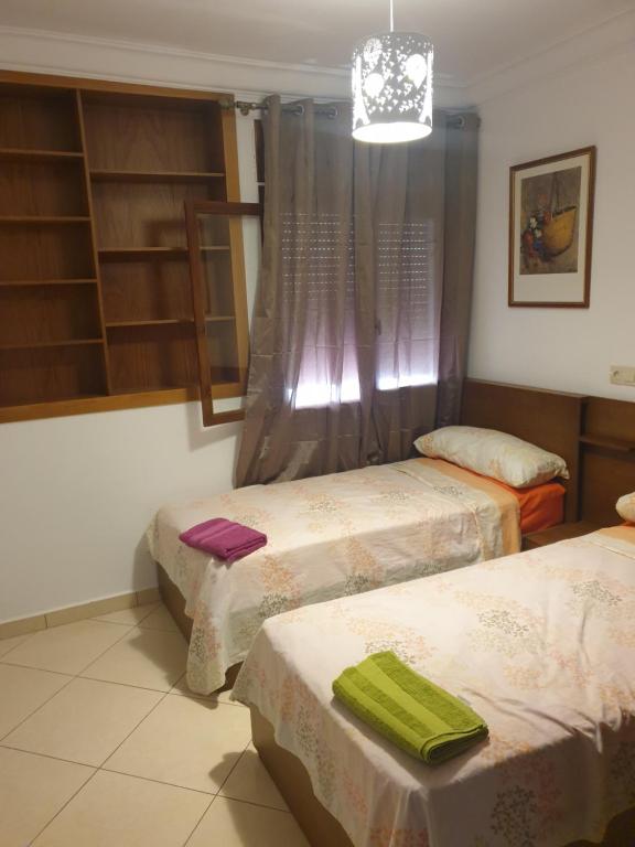 Postel nebo postele na pokoji v ubytování Résidence EL AMAL
