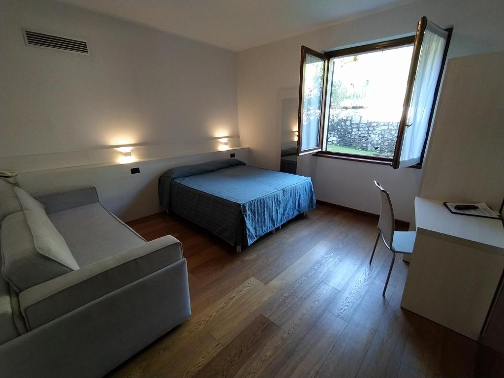 Postel nebo postele na pokoji v ubytování Albergo Ristorante Orazio